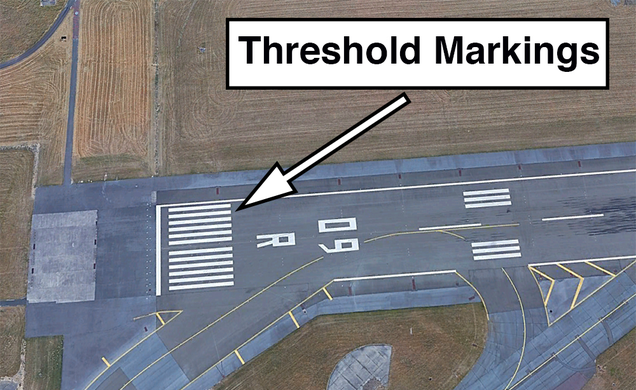 The landing threshold at Paris Charles de Gaulle Airport (LFPG). A total of 12 stripes indicates a runway that is 150 feet wide. (Google Earth)
